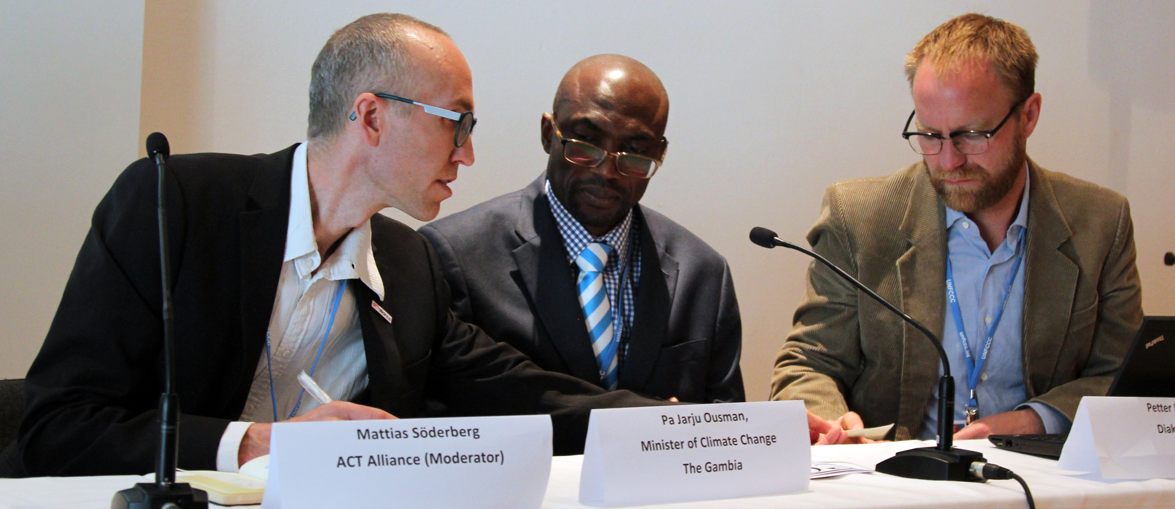 From R-L: Petter Lydén; Pa Ousman Jarju, Minister of Climate Change, Water and Wildlife, the Gambia; Mattias Söderberg, ACT Alliance. Photo: IISD